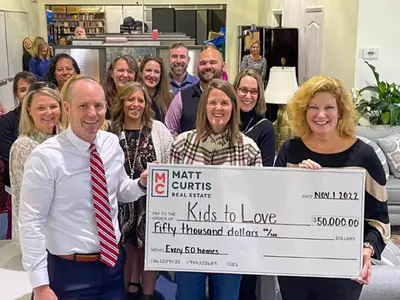 Matt Curtis Real Estate is making a significant impact with a $100,000 donation to the Kids to Love Foundation, aimed at supporting the organization’s Child Placing Agency. This contribution will help fund case managers who match foster children with fami